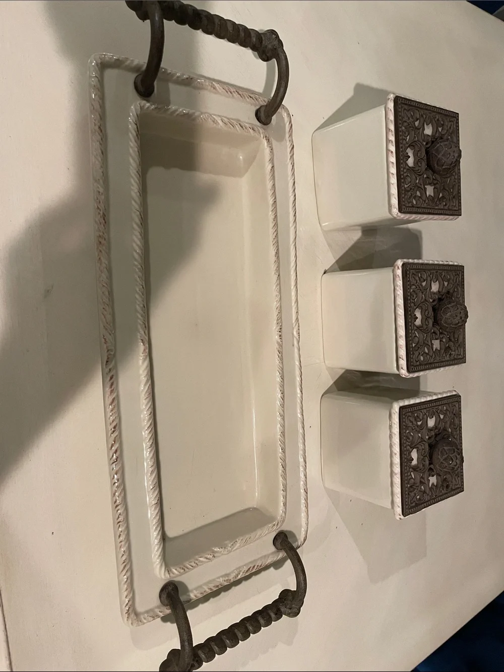 Cream Ceramic Wall-Mounted Trio with Ornate Brown Metal Lids